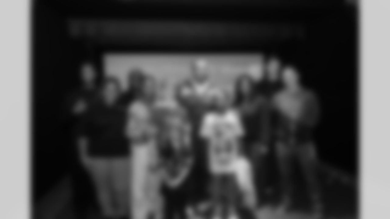 Detroit Lions wide receiver Amon-Ra St. Brown (14) greets guests during a Strike for Literacy event at Five Iron Golf on Nov. 3, 2025 in Detroit.(Carl Jones II/Detroit Lions)