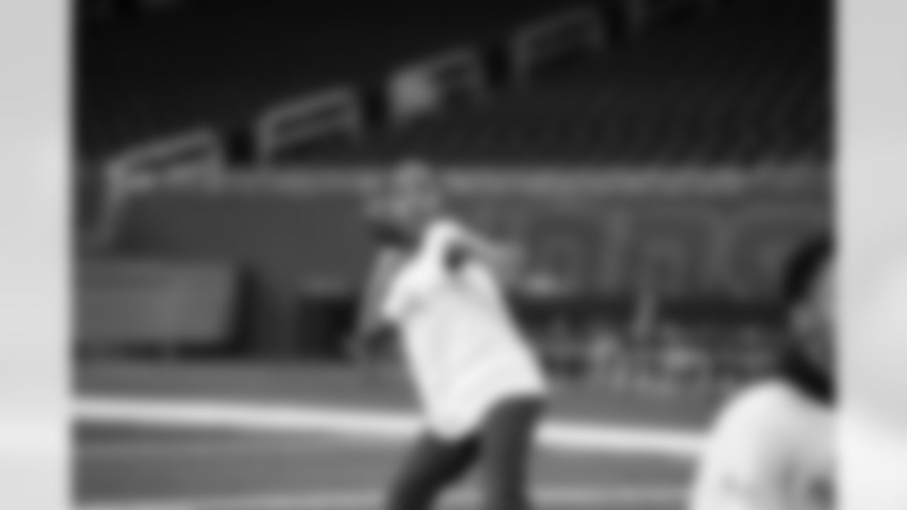 A participant throwing a football during the Inspire Change Football Clinic at Ford Field on Dec. 9, 2025 in Detroit. (Izzy Rincon/Detroit Lions)