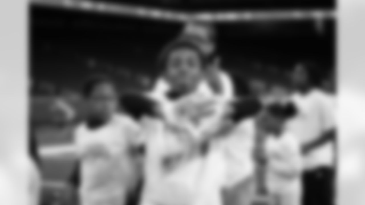 A participant posing for a photo during the Inspire Change Football Clinic at Ford Field on Dec. 9, 2025 in Detroit. (Izzy Rincon/Detroit Lions)