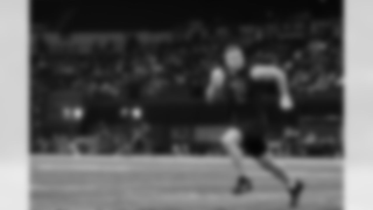 Michigan defensive lineman Aidan Hutchinson (31) participates in a drill at the NFL football scouting combine, Saturday, March 5, 2022 in Indianapolis. (Ben Liebenberg via AP)