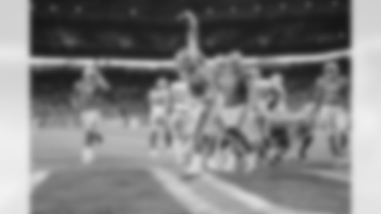 Detroit Lions offensive lineman Frank Ragnow (77) spikes the football in celebration after a rushing touchdown during a NFL football game against the Green Bay Packers on Sunday, Oct. 7, 2018 in Detroit. (Detroit Lions via AP).