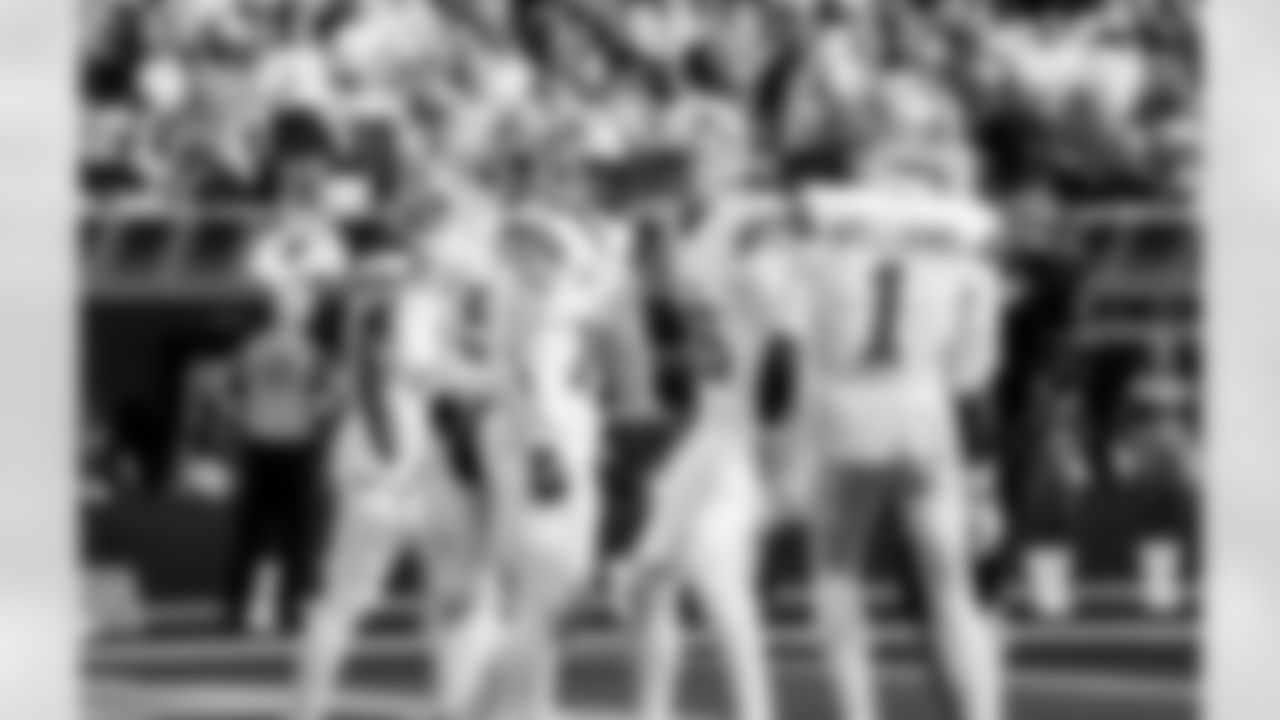 Detroit Lions wide receiver Amon-Ra St. Brown (14), Detroit Lions quarterback Jared Goff (16), and Detroit Lions wide receiver Jameson Williams (1) celebrate after a touchdown during an NFL football game against the Los Angeles Rams on Sunday, Dec. 14, 2025 in Inglewood, Calif. (Jeff Nguyen/Detroit Lions via AP)