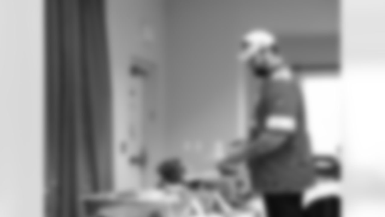 Detroit Lions tackle Taylor Decker (68) making a plate of food during a Thanksgiving lunch event at Alternatives For Girls on Nov. 28, 2025 in Detroit. (Izzy Rincon/Detroit Lions)