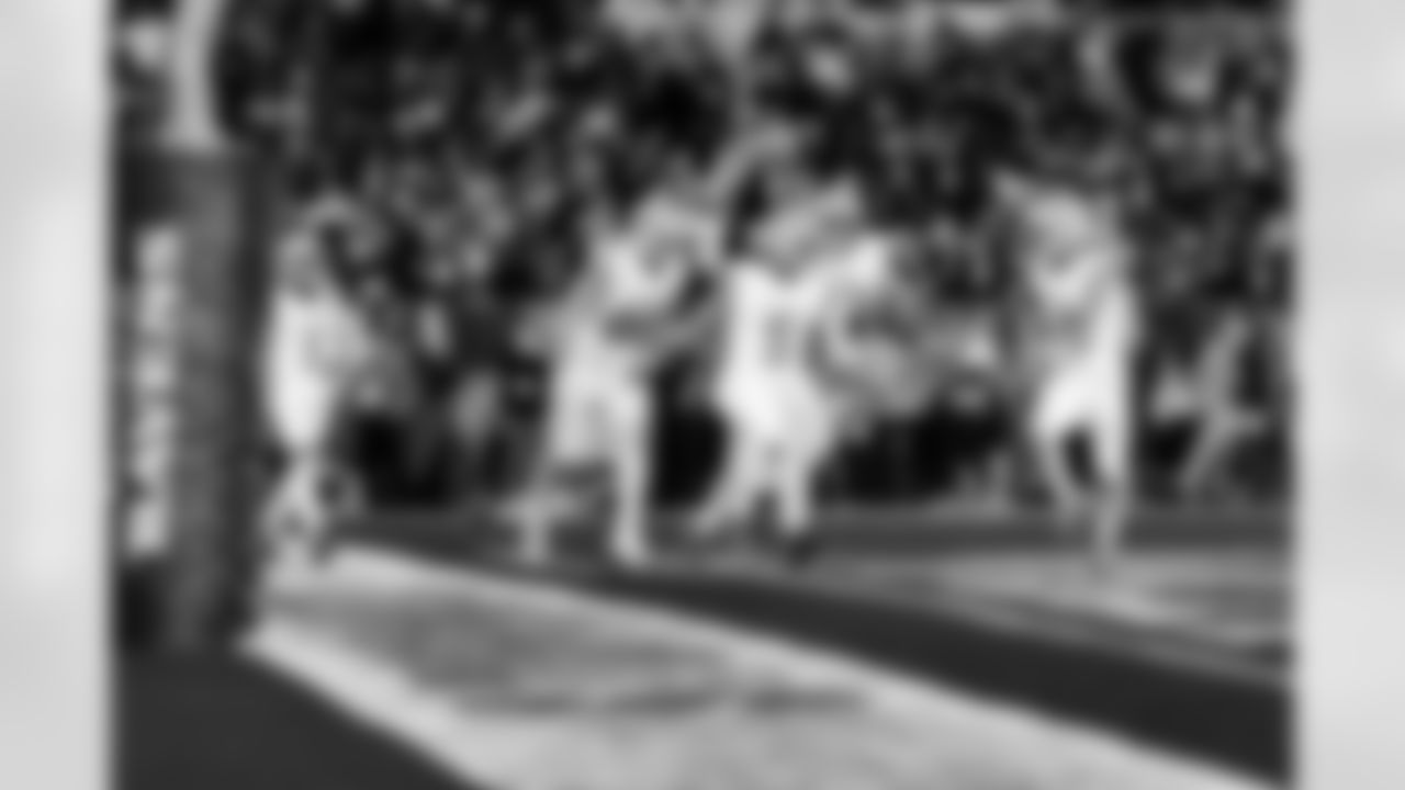 Detroit Lions running back David Montgomery (5) celebrates with Detroit Lions tight end Sam LaPorta (87), Detroit Lions offensive lineman Christian Mahogany (73) and Detroit Lions wide receiver Amon-Ra St. Brown (14) after he scores a touchdown during an NFL football game against the Baltimore Ravens on Monday, Sept. 22, 2025 in Baltimore. (Jeff Nguyen/Detroit Lions via AP)