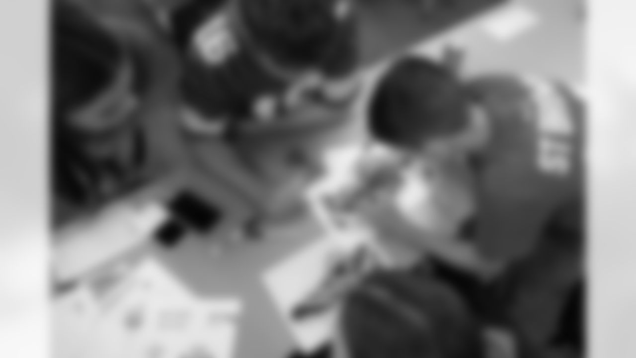 Shoe Club students work on their designs during a shoe design competition event at the Meijer Performance Center on Sept. 27, 2025 in Allen Park, Mich. (Carl Jones II/Detroit Lions via AP)