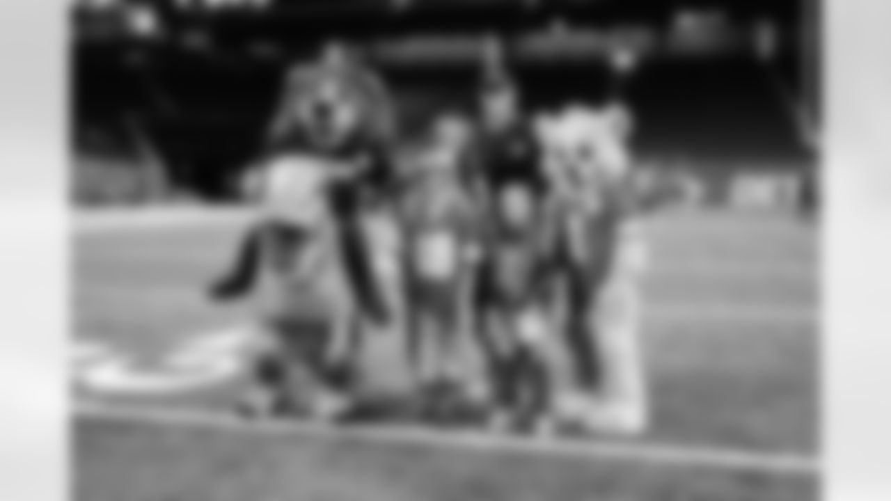 Cub Club members take a photo with Detroit Lions Mascot Roaryl during the Cub Club Halloween event at Ford Field on Oct. 29, 2025 in Detroit. (Mike Ferdinande/Detroit Lions)