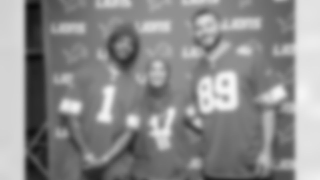 Detroit Lions wide receiver Jameson Williams (1) and Detroit Lions tight end Brock Wright (89) pose for a photo with a fan during the Detroit Lions Draft Party at Ford Field on April 24, 2025 in Detroit. (Stephanie VanWagoner/Detroit Lions)