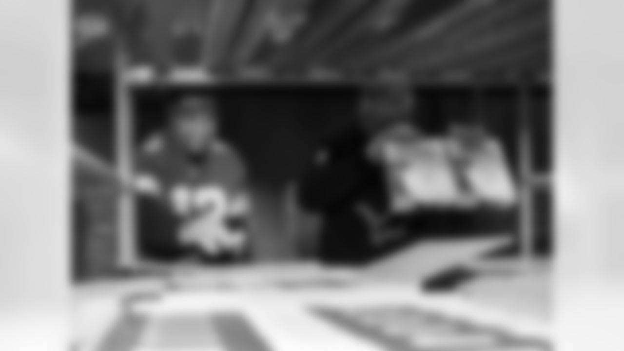 Detroit Lions running back Craig Reynolds (13) packing boxes during a Thanksgiving meal packing event at Gleaners Community Food Bank on Nov. 11, 2025 in Taylor, Mich. (Izzy Rincon/Detroit Lions)