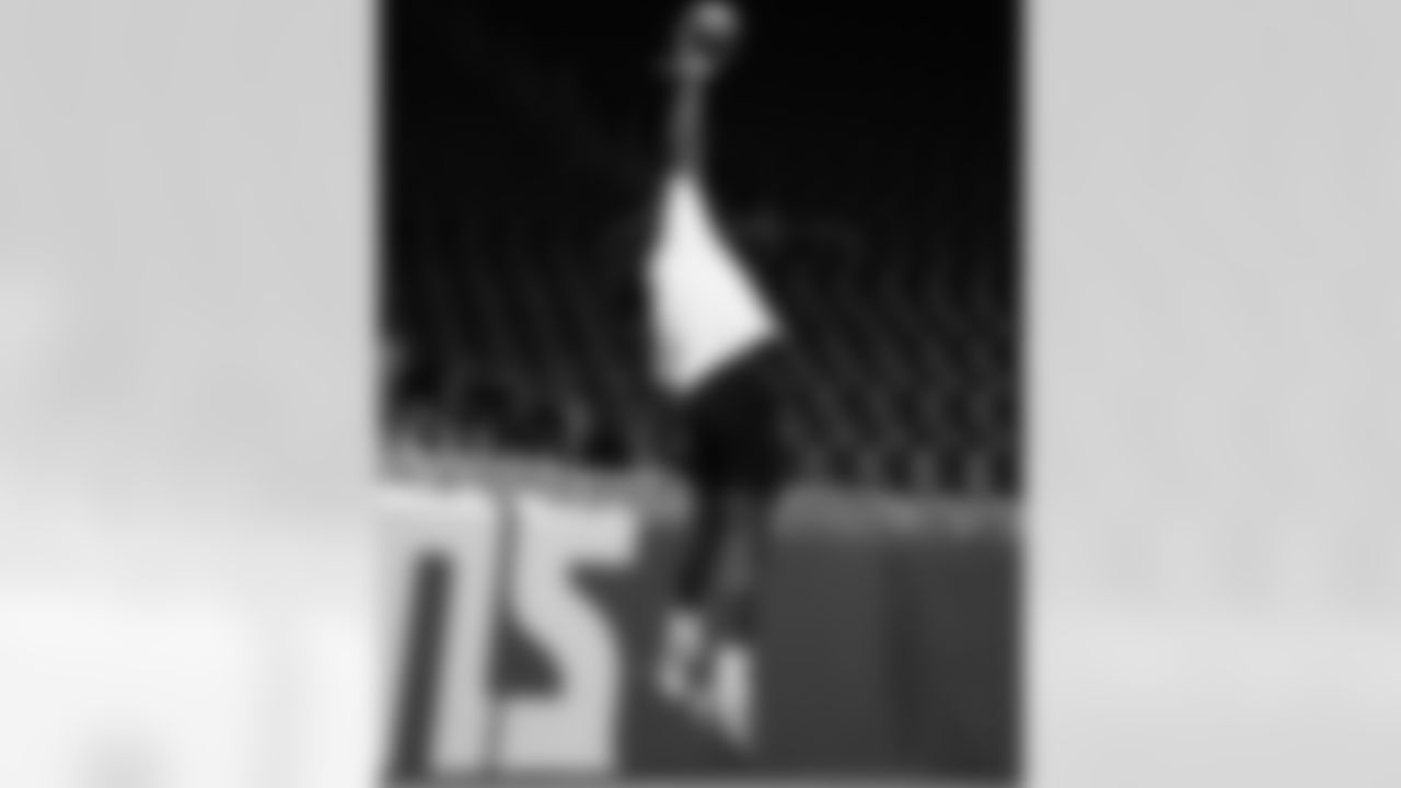 A participant catching a football during the Inspire Change Football Clinic at Ford Field on Dec. 9, 2025 in Detroit. (Izzy Rincon/Detroit Lions)