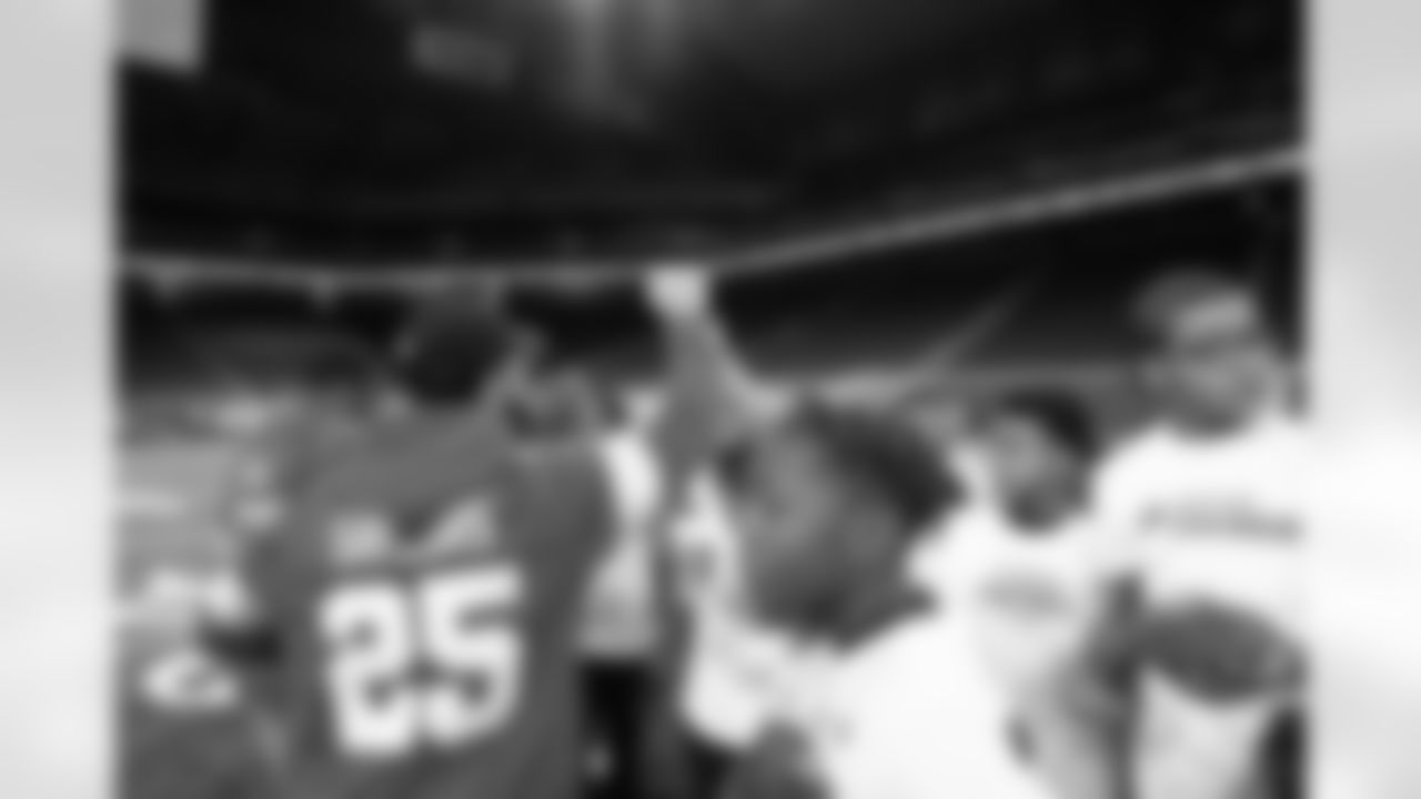 Detroit Lions runningback Jacob Saylors (25) breaking down the group during the Inspire Change Football Clinic at Ford Field on Dec. 9, 2025 in Detroit. (Izzy Rincon/Detroit Lions)