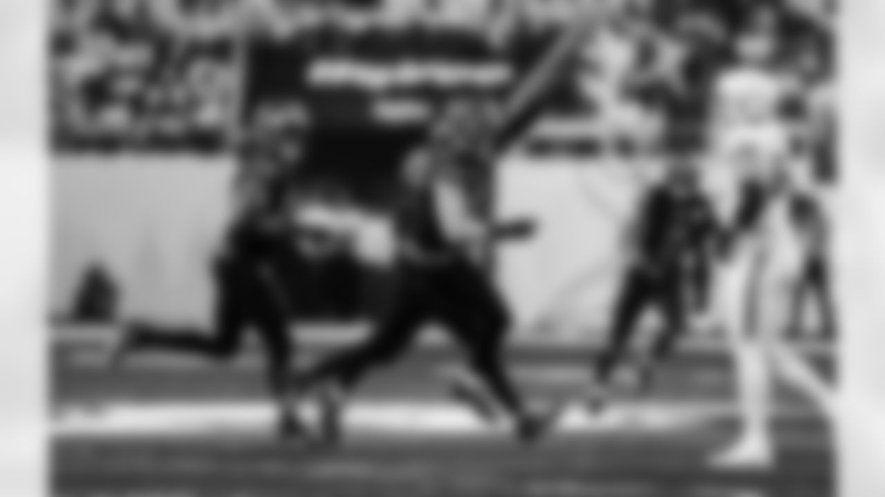 Detroit Lions edge rusher Al-Quadin Muhammad (96), Detroit Lions linebacker Alex Anzalone (34), and Detroit Lions edge rusher Aidan Hutchinson (97) celebrate after a sack during an NFL football game against the Minnesota Vikings on Thursday, Dec. 25, 2025 in Minneapolis. (Jeff Nguyen/Detroit Lions via AP)