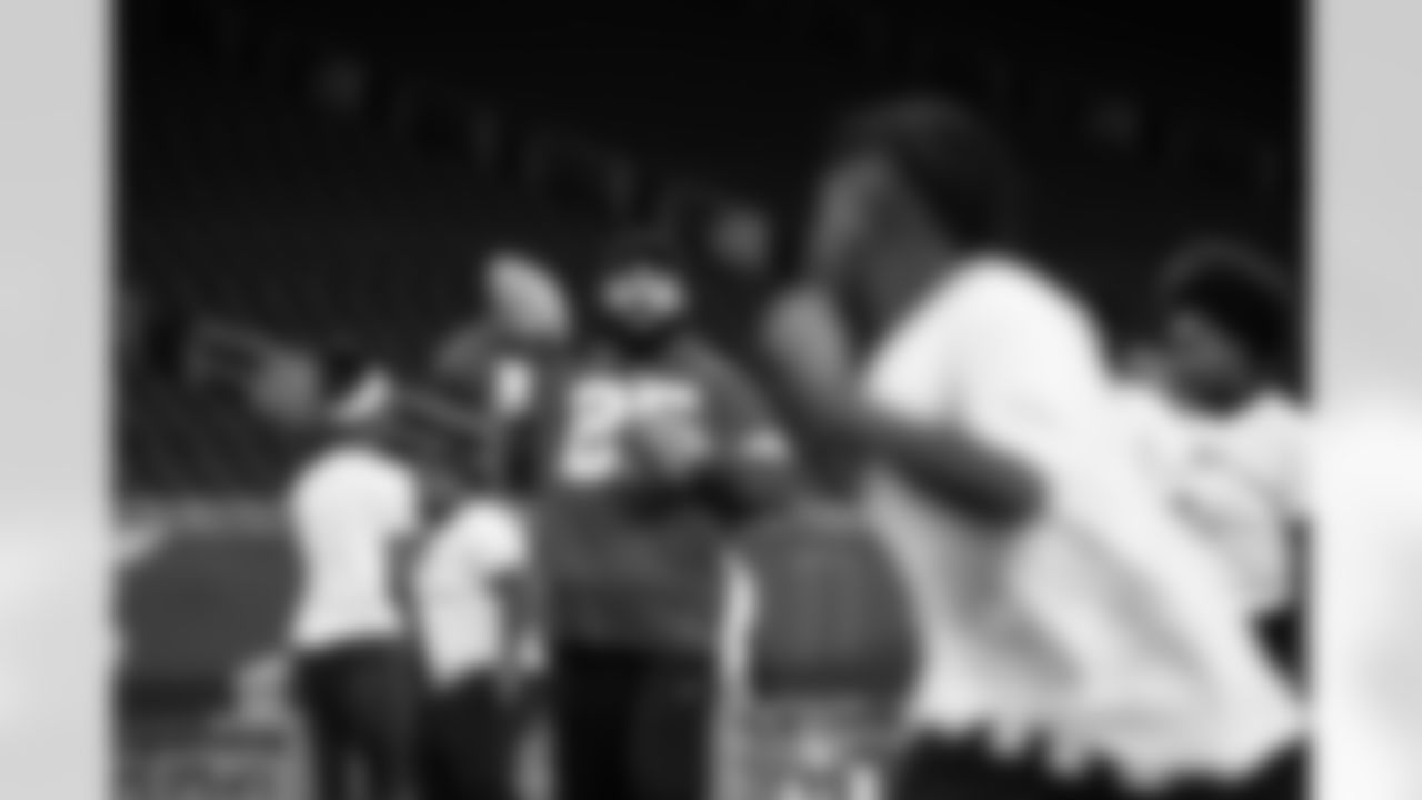 Detroit Lions running back Jacob Saylors (25) throwing the football to participants during the Inspire Change Football Clinic at Ford Field on Dec. 9, 2025 in Detroit. (Izzy Rincon/Detroit Lions)