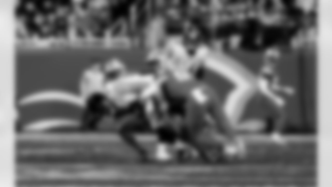 Detroit Lions edge rusher Aidan Hutchinson (97) sacks Pittsburgh Steelers quarterback Aaron Rodgers (8) during an NFL football game against the Pittsburgh Steelers on Sunday, Dec. 21, 2025 in Detroit. (Jeff Nguyen/Detroit Lions via AP)