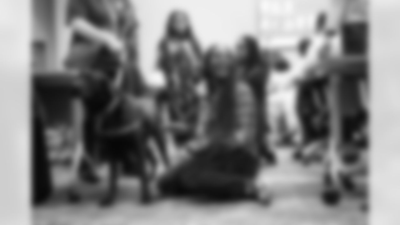 DLA students petting service dogs during a Detroit Lions Academy health and wellness field trip at the Henry Ford Health campus on Feb. 27, 2026 in Detroit. (Izzy Rincon/Detroit Lions)