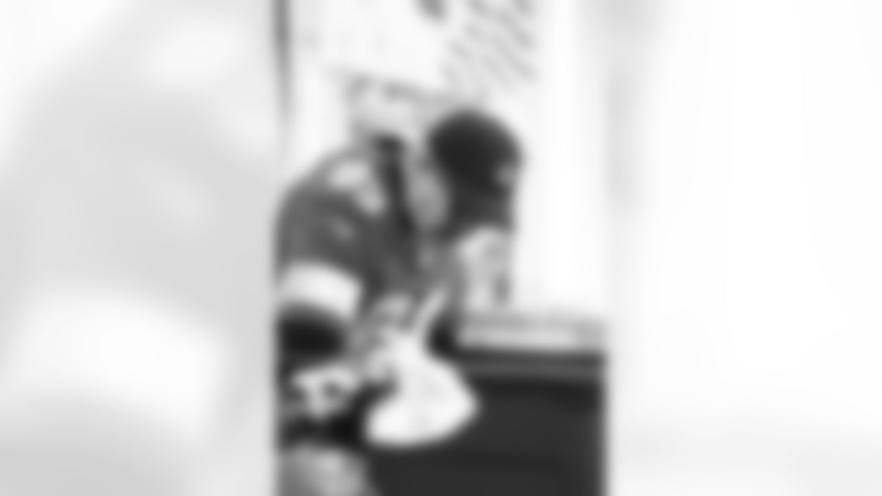 Lions Legend Jeff Chadwick (89) handing out presents during the Presents from the Pride event at Detroit Lions Academy on Dec. 16, 2025 in Detroit. (Izzy Rincon/Detroit Lions)