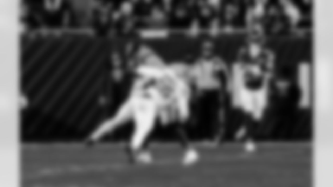 Detroit Lions linebacker Derrick Barnes (55) forces a fumble during an NFL football game against the Chicago Bears on Sunday, Jan. 4, 2026 in Chicago. (Jeff Nguyen/Detroit Lions via AP)