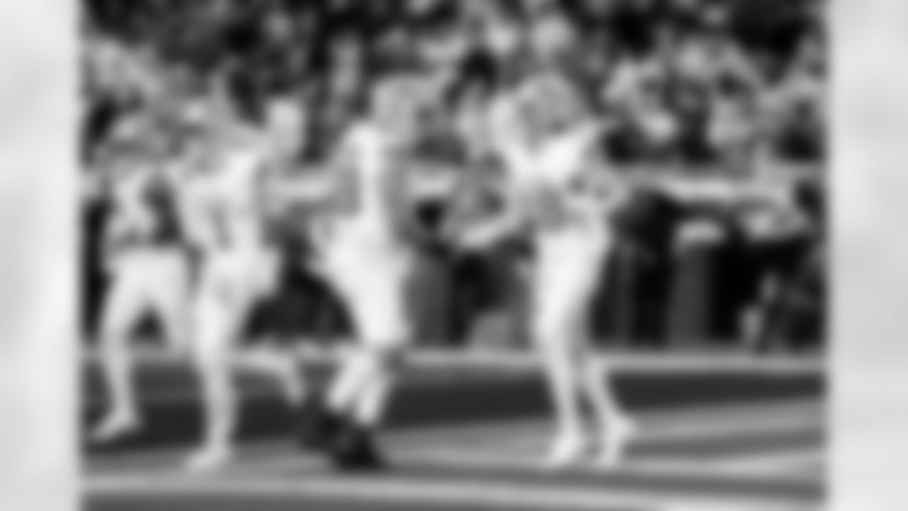 Detroit Lions offensive lineman Tate Ratledge (69) and Detroit Lions wide receiver Isaac TeSlaa (18) celebrate after a touchdown during an NFL football game against the Dallas Cowboys on Thursday, Dec. 4, 2025 in Detroit. (Jeff Nguyen/Detroit Lions via AP)