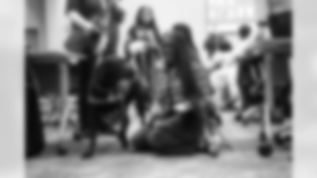 DLA students petting service dogs during a Detroit Lions Academy health and wellness field trip at the Henry Ford Health campus on Feb. 27, 2026 in Detroit. (Izzy Rincon/Detroit Lions)