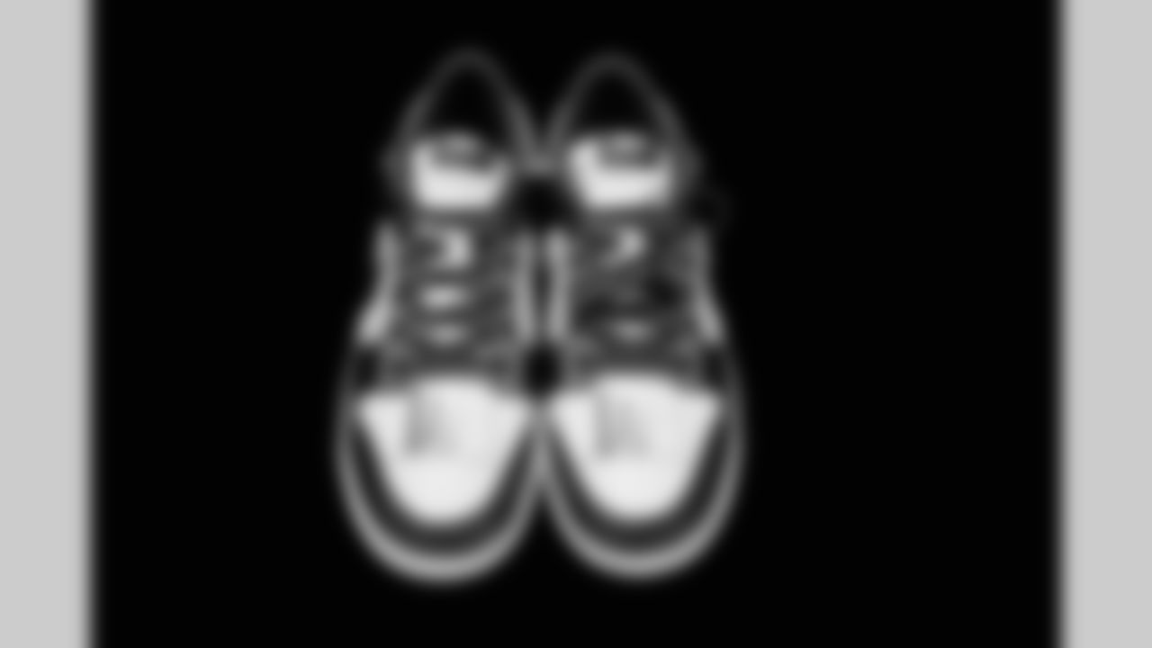 Cleats belonging to Detroit Lions run game coordinator/defensive line coach Kacy Rodgers photographed at the Meijer Performance Center on Nov. 12, 2025 in Allen Park, Mich. (Jeff Nguyen/Detroit Lions)