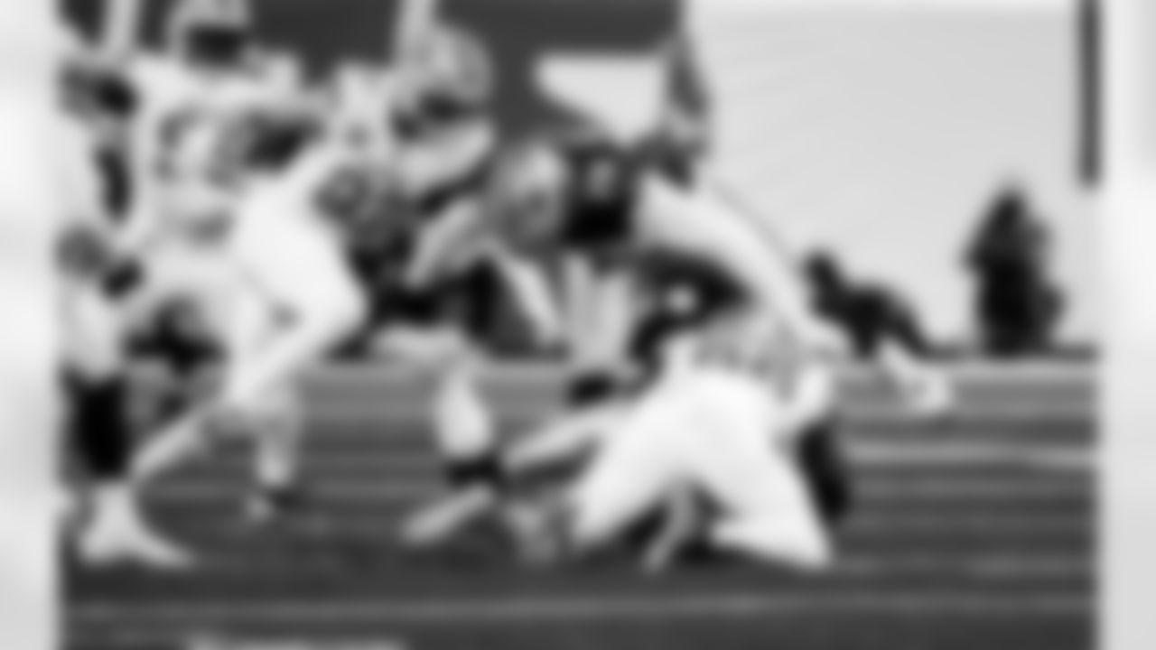 Detroit Lions edge rusher Al-Quadin Muhammad (96) sacks Dallas Cowboys quarterback Dak Prescott (4) during an NFL football game against the Dallas Cowboys on Thursday, Dec. 4, 2025 in Detroit. (Jeff Nguyen/Detroit Lions via AP)