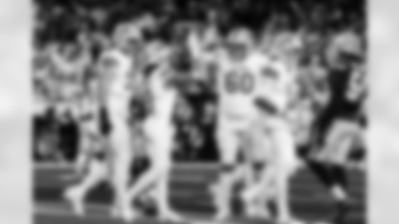 Detroit Lions tackle Dan Skipper (70), Detroit Lions running back Jahmyr Gibbs (0), and Detroit Lions offensive lineman Graham Glasgow (60) celebrate after a touchdown during an NFL football game against the Dallas Cowboys on Thursday, Dec. 4, 2025 in Detroit. (Jeff Nguyen/Detroit Lions via AP)