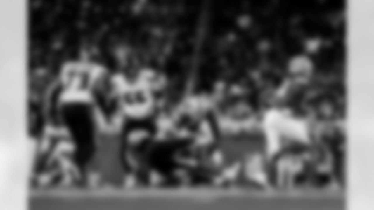 Detroit Lions edge rusher Al-Quadin Muhammad (96) sacks Houston Texans quarterback Graham Mertz (18) during an NFL football game against the Houston Texans on Saturday, Aug. 23, 2025 in Detroit. (Jeff Nguyen/Detroit Lions via AP)