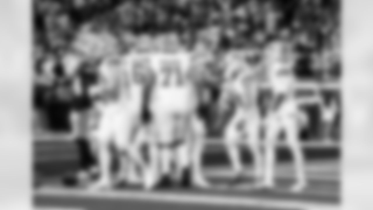 Detroit Lions offensive lineman Miles Frazier (71), Detroit Lions running back Jahmyr Gibbs (0), and Detroit Lions wide receiver Amon-Ra St. Brown (14) celebrate after a touchdown during an NFL football game against the Dallas Cowboys on Thursday, Dec. 4, 2025 in Detroit. (Jeff Nguyen/Detroit Lions via AP)