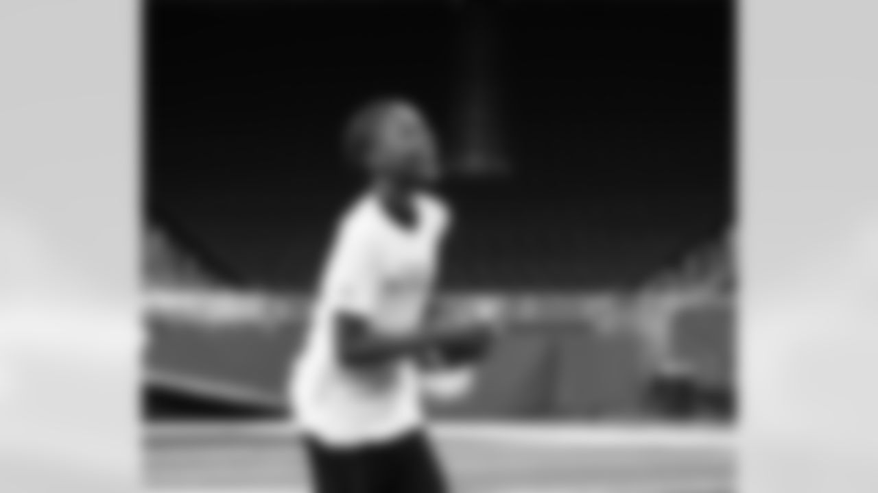 A participant smiling during the Inspire Change Football Clinic at Ford Field on Dec. 9, 2025 in Detroit. (Izzy Rincon/Detroit Lions)