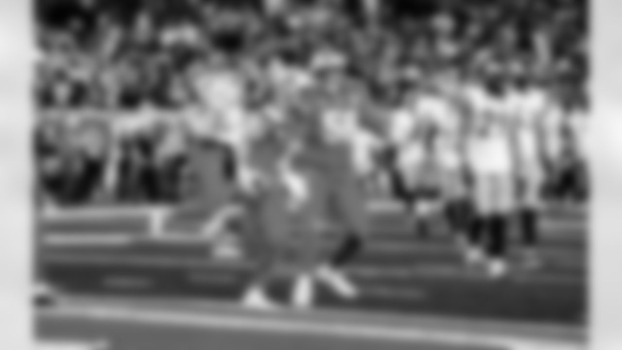 Detroit Lions wide receiver Kalif Raymond (11) and Detroit Lions tackle Penei Sewell (58) celebrate after a touchdown during an NFL football game against the Pittsburgh Steelers on Sunday, Dec. 21, 2025 in Detroit. (Jeff Nguyen/Detroit Lions via AP)