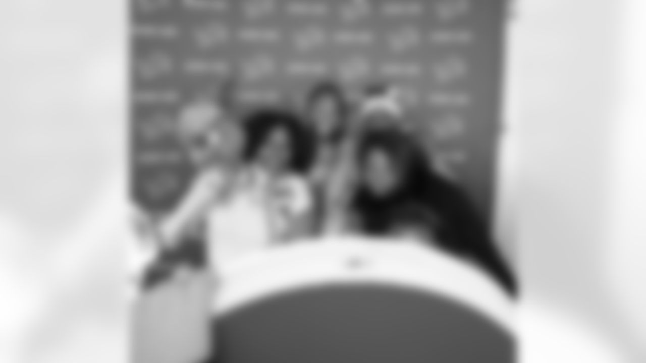 Students pose in the photobooth during the Presents from the Pride event at Detroit Lions Academy on Dec. 16, 2025 in Detroit. (Izzy Rincon/Detroit Lions)