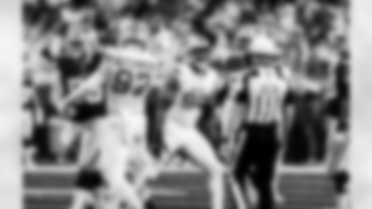 Detroit Lions edge rusher Aidan Hutchinson (97) and Detroit Lions edge rusher Al-Quadin Muhammad (96) during an NFL football game against the Dallas Cowboys on Thursday, Dec. 4, 2025 in Detroit. (Jeff Nguyen/Detroit Lions via AP)