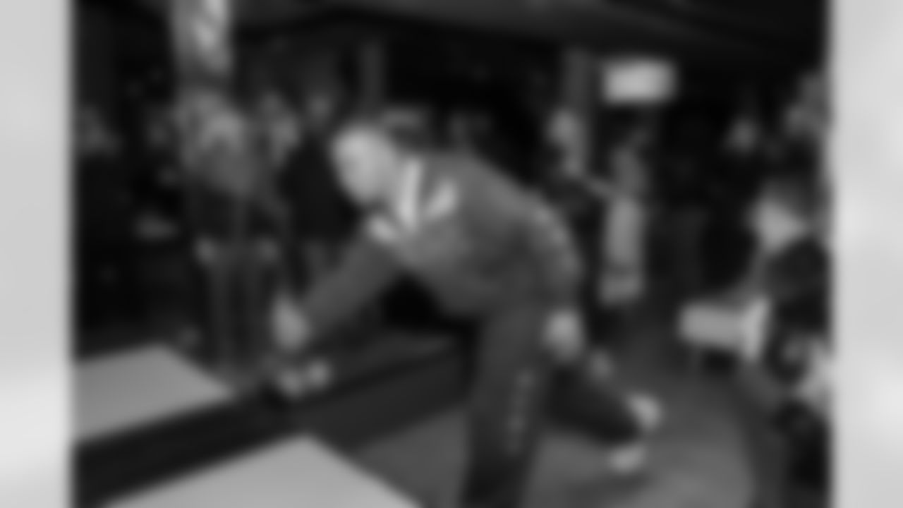 Detroit Lions wide receiver Amon-Ra St. Brown (14) greets guests during a Strike for Literacy event at Five Iron Golf on Nov. 3, 2025 in Detroit.(Carl Jones II/Detroit Lions)