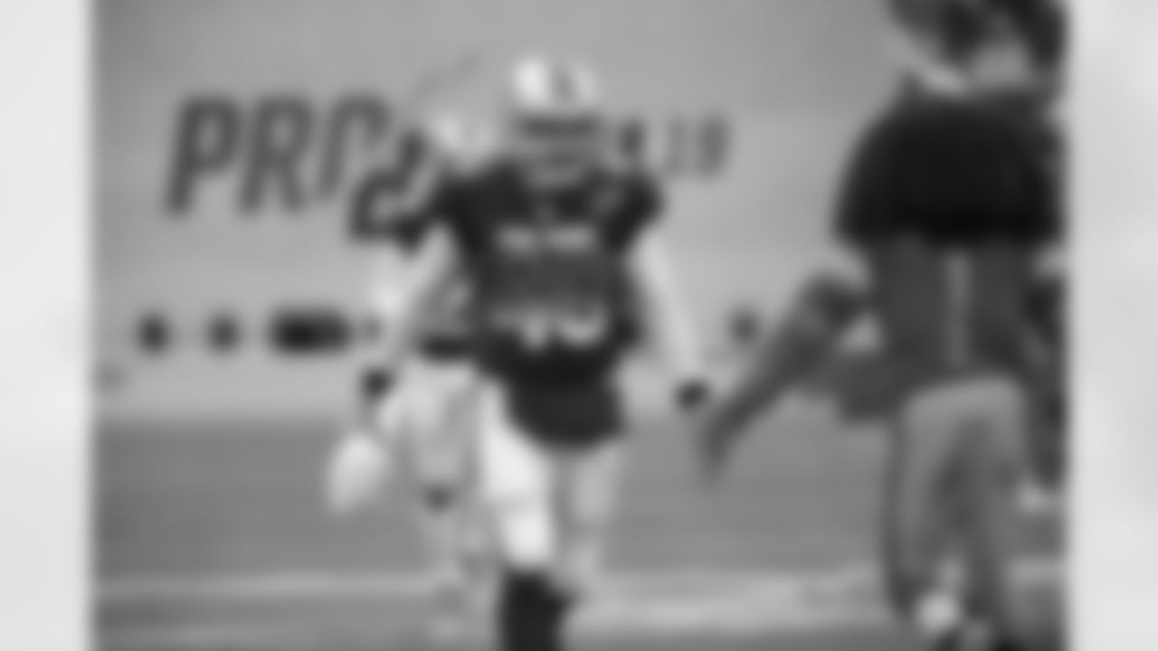 NFC long snapper Don Muhlbach (48), of the Detroit Lions, runs onto the field during player introductions before the NFL Pro Bowl football game against the AFC Sunday, Jan. 27, 2019, in Orlando, Fla. (AP Photo/Phelan M. Ebenhack)