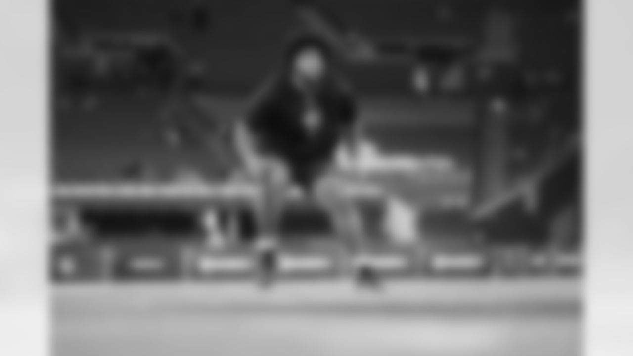 Alabama offensive lineman Kadyn Proctor (41) runs a drill at the NFL football scouting combine in Indianapolis, Sunday, March 1, 2026. (AP Photo/Michael Conroy)