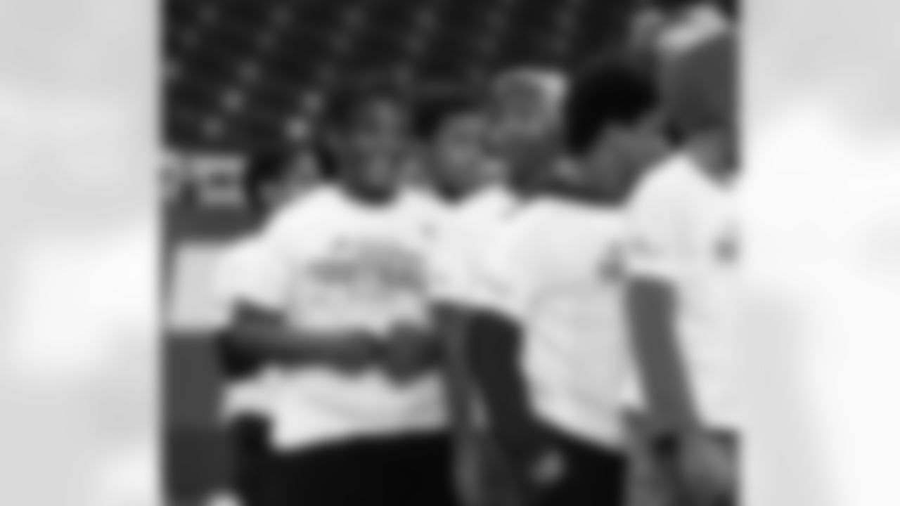 A participant smiling during the Inspire Change Football Clinic at Ford Field on Dec. 9, 2025 in Detroit. (Izzy Rincon/Detroit Lions)