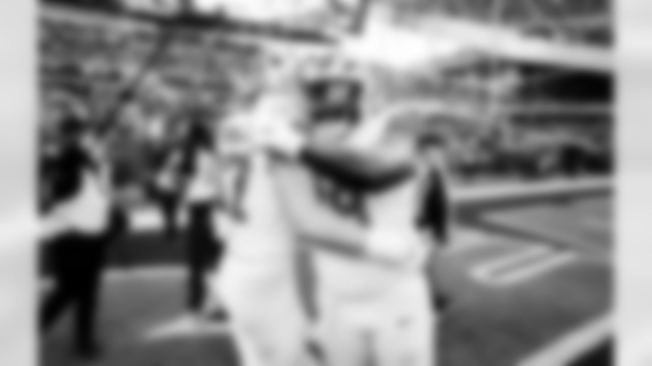 Detroit Lions edge rusher Aidan Hutchinson (97) and Detroit Lions defensive lineman DJ Reader (98) before an NFL football game against the Chicago Bears on Sunday, Jan. 4, 2026 in Chicago. (Jeff Nguyen/Detroit Lions via AP)