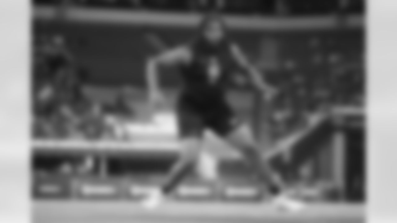 Texas A&M offensive lineman Dametrious Crownover (16) runs a drill at the NFL football scouting combine in Indianapolis, Sunday, March 1, 2026. (AP Photo/Michael Conroy)