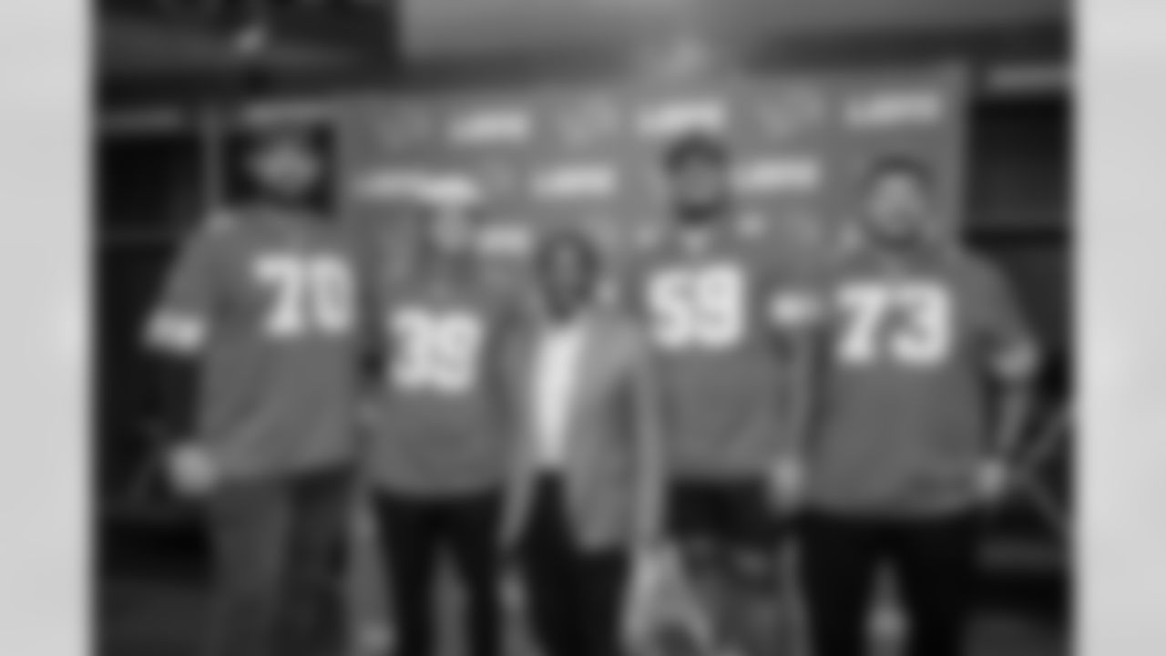 Detroit Lions tackle Dan Skipper (70), Detroit Lions kicker Jake Bates (39), Detroit Lions offensive lineman Giovanni Manu (59) and Detroit Lions offensive lineman Christian Mahogany (73) pose for a photo with a fan during the Detroit Lions Draft Party at Ford Field on April 24, 2025 in Detroit. (Stephanie VanWagoner/Detroit Lions)