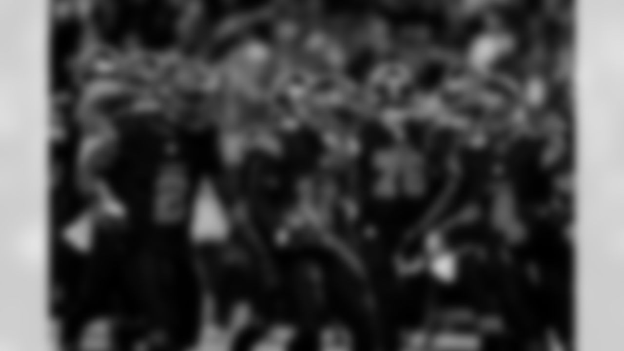 Detroit Lions safety Daniel Thomas (2), Detroit Lions safety Thomas Harper (12), and Detroit Lions cornerback D.J. Reed (4) celebrate after an interception during an NFL football game against the New York Giants on Sunday, Nov. 23, 2025 in Detroit. (Jeff Nguyen/Detroit Lions via AP)