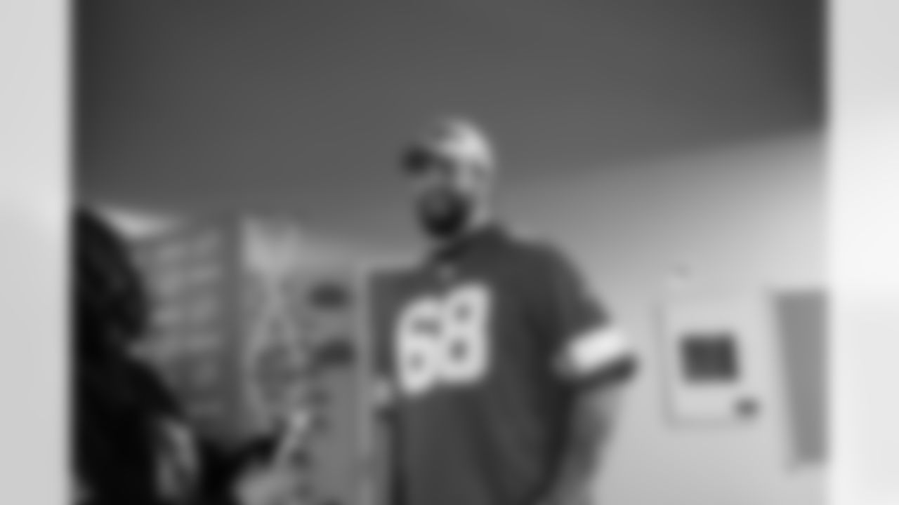 Detroit Lions tackle Taylor Decker (68) smiling during a Thanksgiving lunch event at Alternatives For Girls on Nov. 28, 2025 in Detroit. (Izzy Rincon/Detroit Lions)