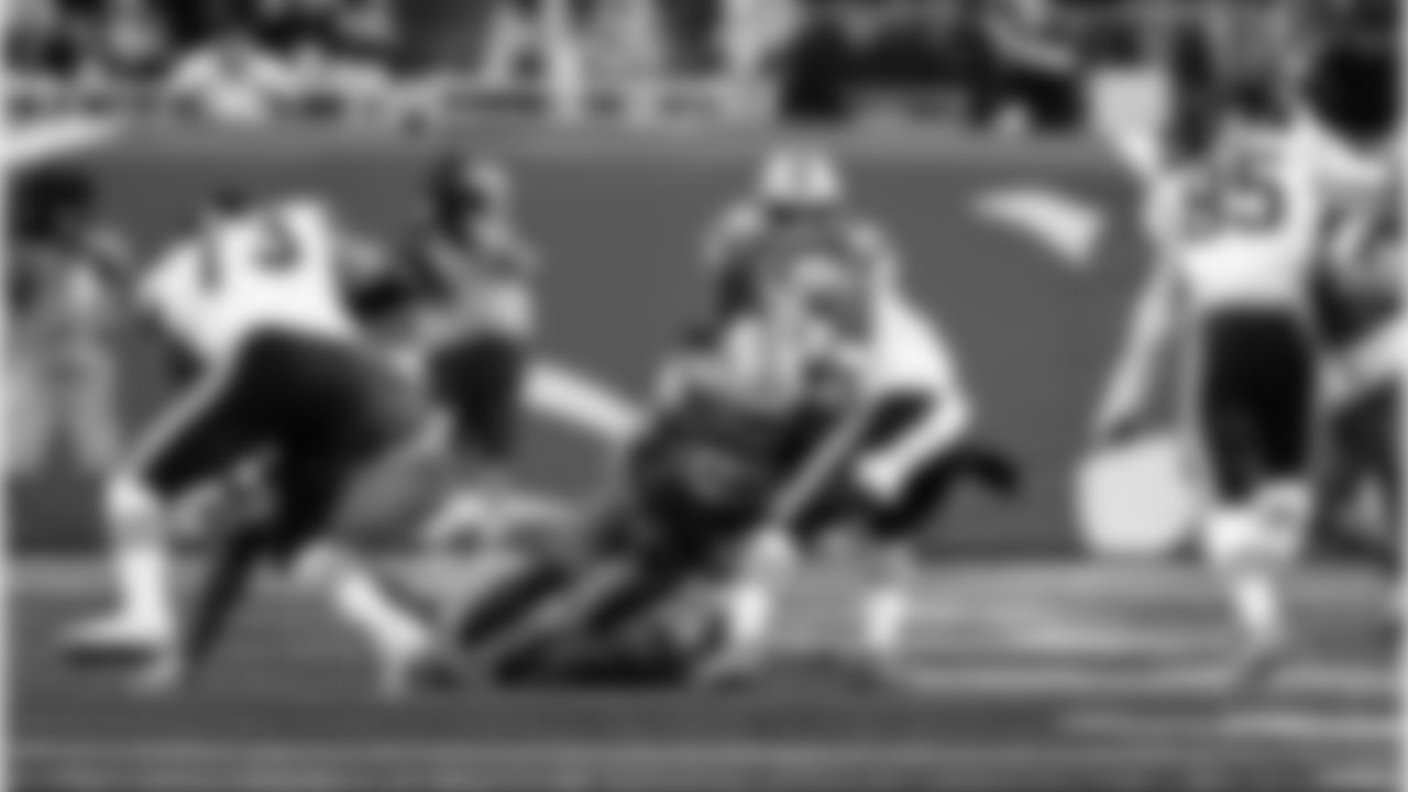 Detroit Lions defensive back Brian Branch (32) forces a fumble during an NFL football game against the Chicago Bears on Sunday, Sept. 14, 2025 in Detroit. (Jeff Nguyen/Detroit Lions via AP)