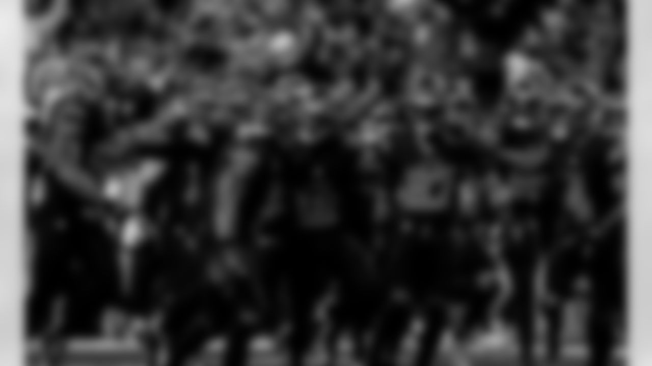 Detroit Lions safety Daniel Thomas (2), Detroit Lions safety Thomas Harper (12), and Detroit Lions cornerback Arthur Maulet (27) celebrate after an interception during an NFL football game against the New York Giants on Sunday, Nov. 23, 2025 in Detroit. (Jeff Nguyen/Detroit Lions via AP)