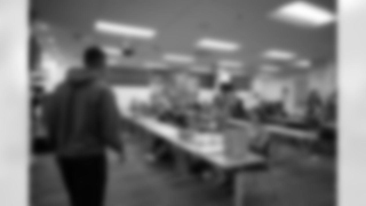 Detroit Lions wide receiver Amon-Ra St. Brown (14) greets students during a shoe design competition event at the Meijer Performance Center on Sept. 27, 2025 in Allen Park, Mich. (Carl Jones II/Detroit Lions via AP)