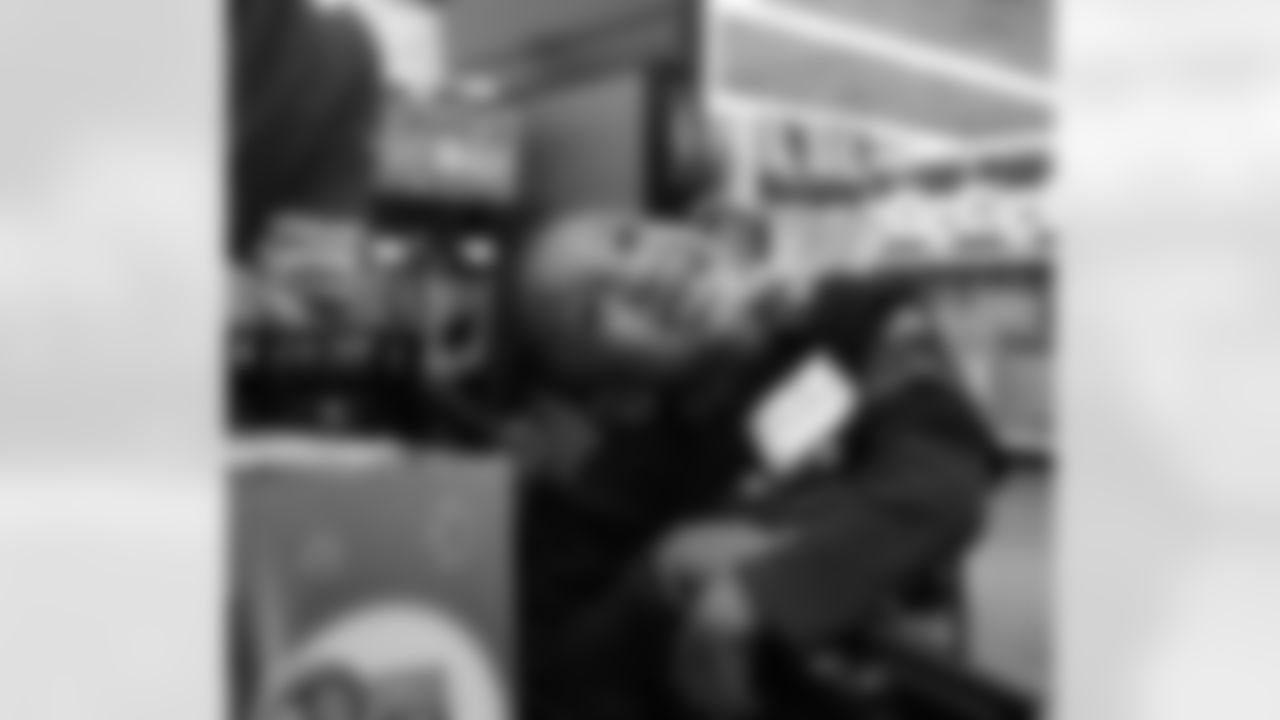 A participant smiling during Shop with a Lion at Meijer on Dec. 8, 2025 in Detroit. (Izzy Rincon/Detroit Lions)