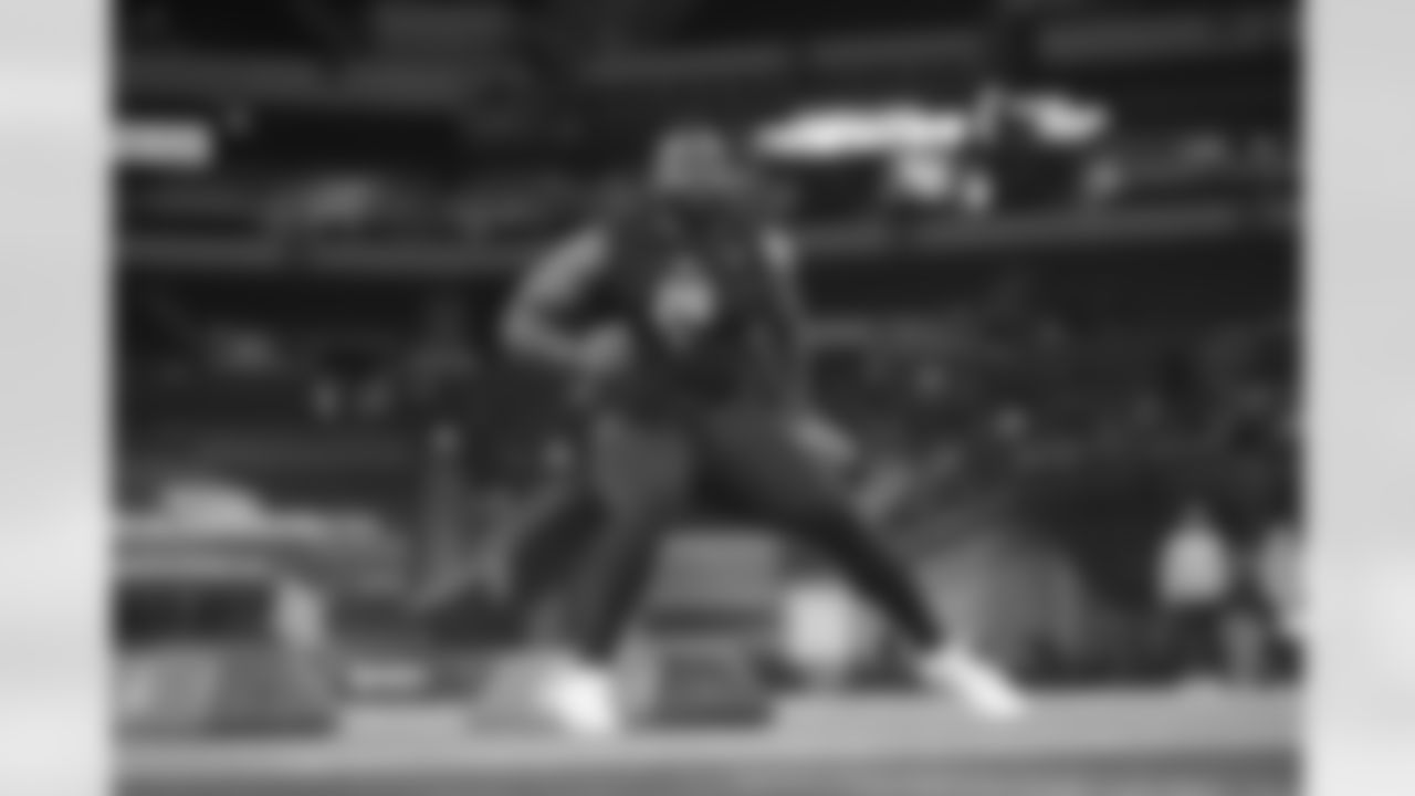 Texas A&M defensive lineman Albert Regis (26) runs a drill at the NFL football scouting combine in Indianapolis, Thursday, Feb. 26, 2026. (AP Photo/Michael Conroy)