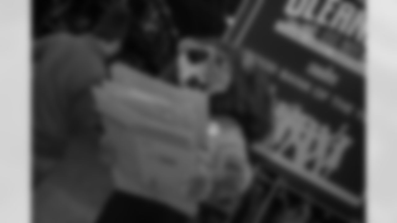 Detroit Lions Mascot Roary moving cardboard during a Thanksgiving meal packing event at Gleaners Community Food Bank on Nov. 11, 2025 in Taylor, Mich. (Izzy Rincon/Detroit Lions)