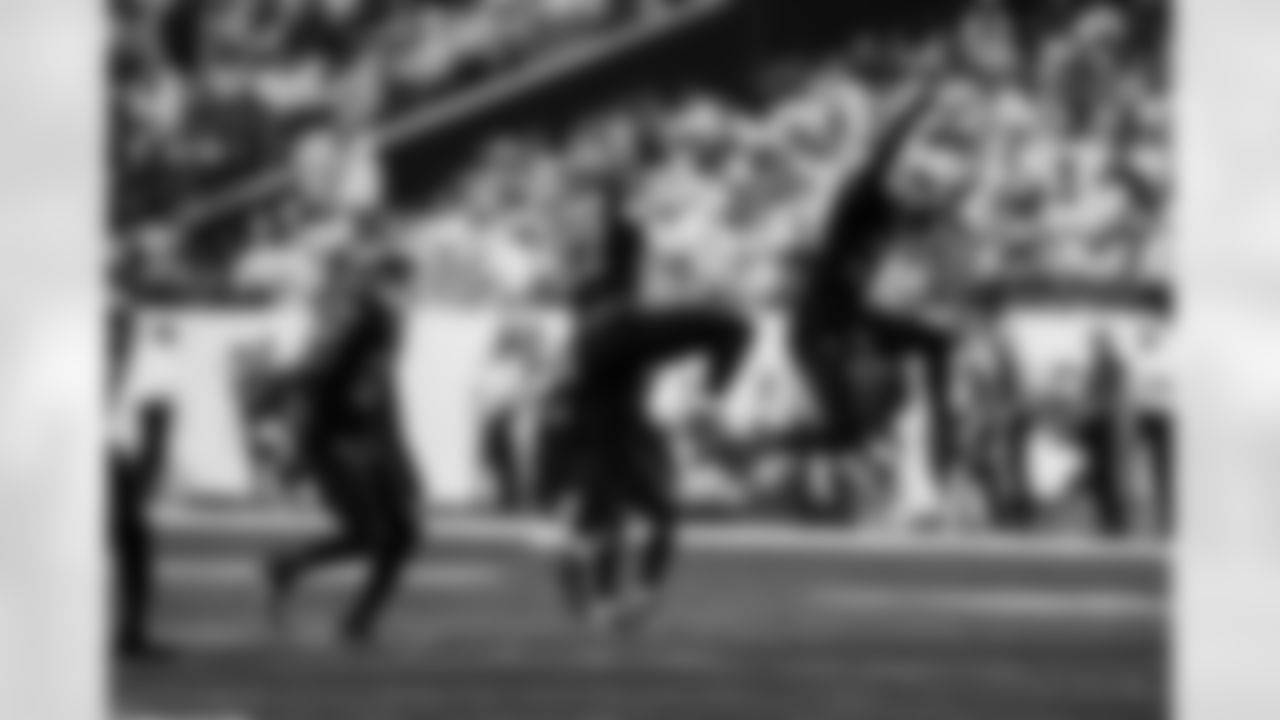 Detroit Lions edge rusher Al-Quadin Muhammad (96), Detroit Lions edge rusher Aidan Hutchinson (97), and Detroit Lions linebacker Alex Anzalone (34) celebrate after a sack during an NFL football game against the Minnesota Vikings on Thursday, Dec. 25, 2025 in Minneapolis. (Jeff Nguyen/Detroit Lions via AP)