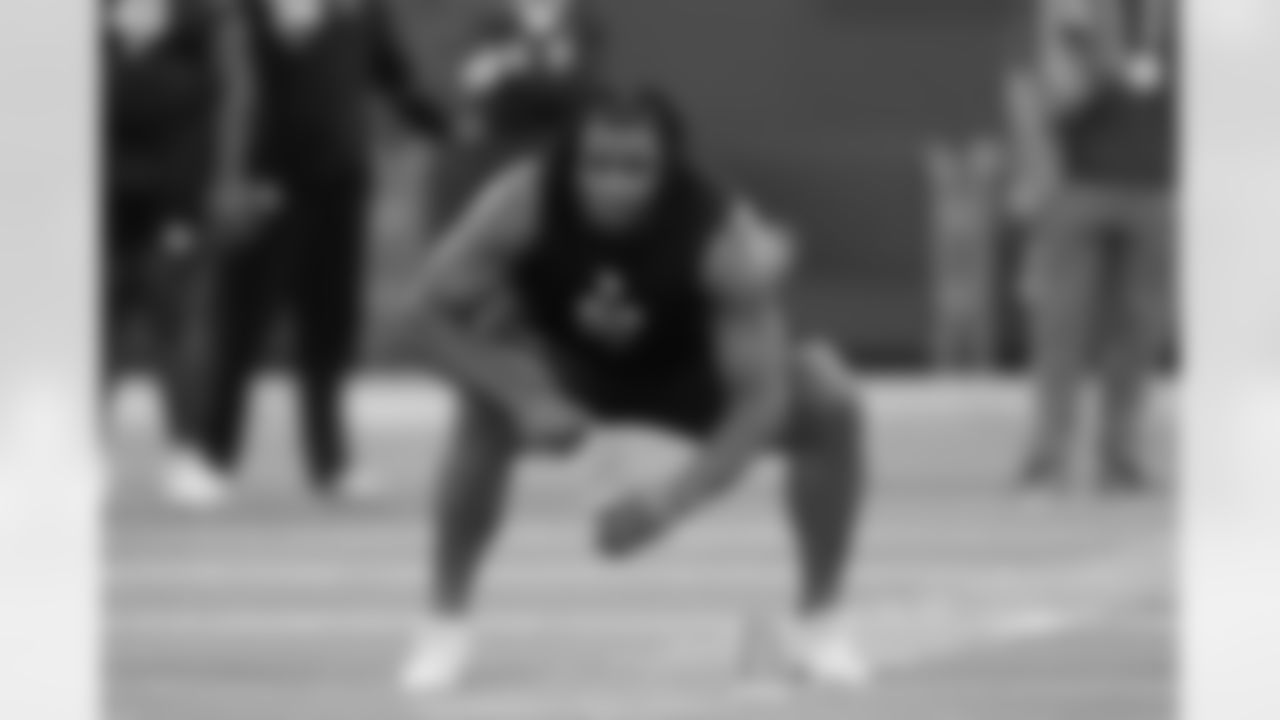 Auburn offensive lineman Jeremiah Wright (56) runs a drill at the NFL football scouting combine in Indianapolis, Sunday, March 1, 2026. (AP Photo/Michael Conroy)