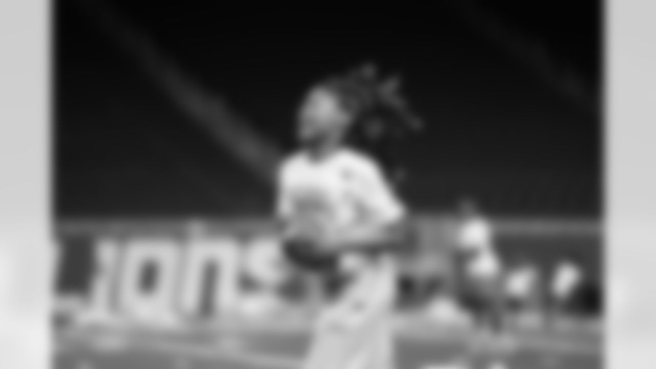 A participant running with the football during the Inspire Change Football Clinic at Ford Field on Dec. 9, 2025 in Detroit. (Izzy Rincon/Detroit Lions)