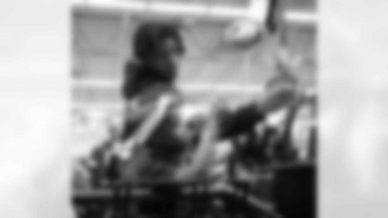 Detroit Lions wide receiver Jameson Williams (1) and a participant swiping Meijer giftcards during Shop with a Lion at Meijer on Dec. 8, 2025 in Detroit. (Izzy Rincon/Detroit Lions)